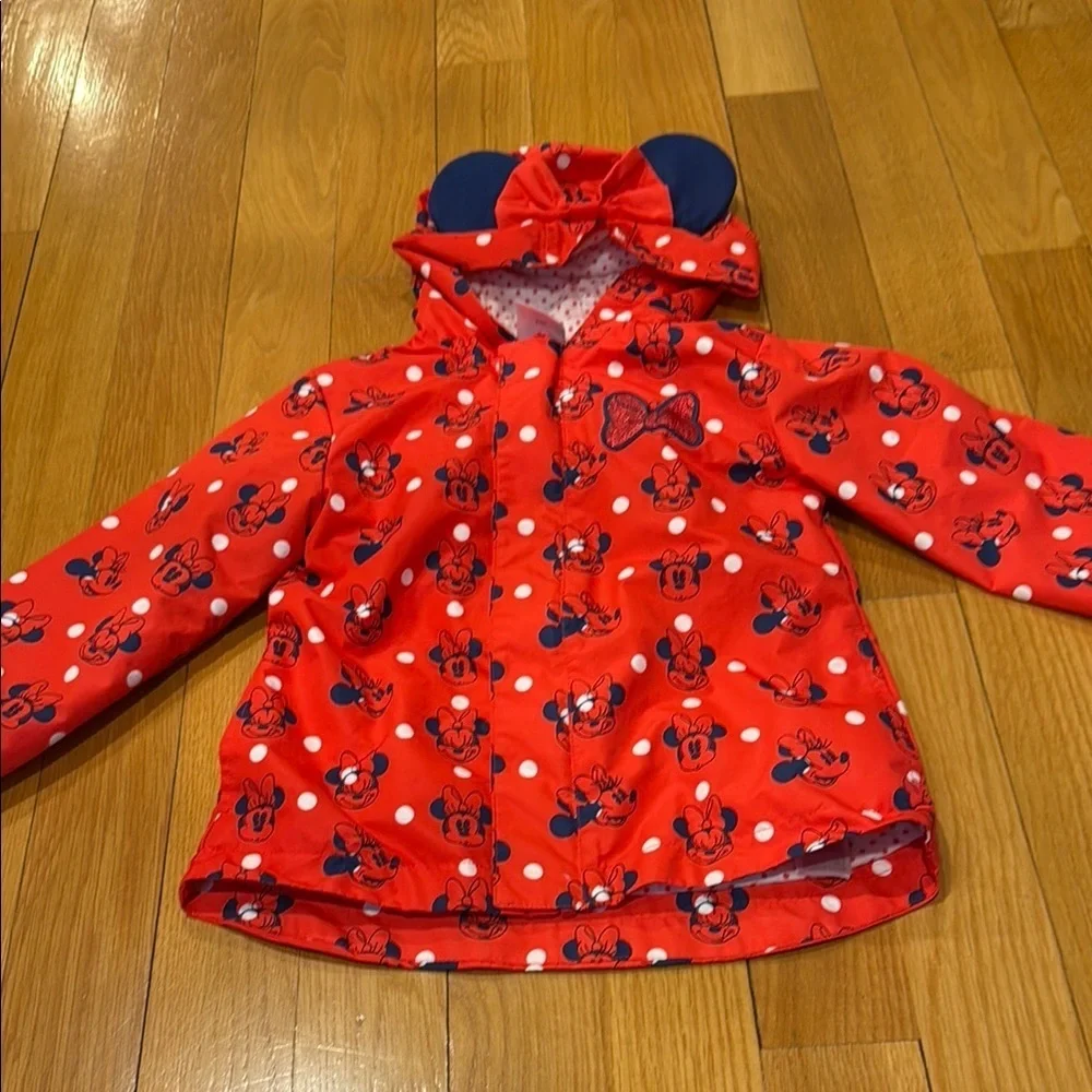 Disney Minnnie Mouse red packable rain jacket and attached carry bag size 4 .